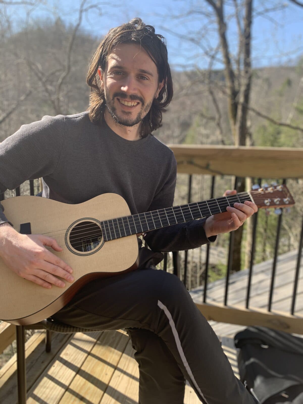 Playing guitar on the porch