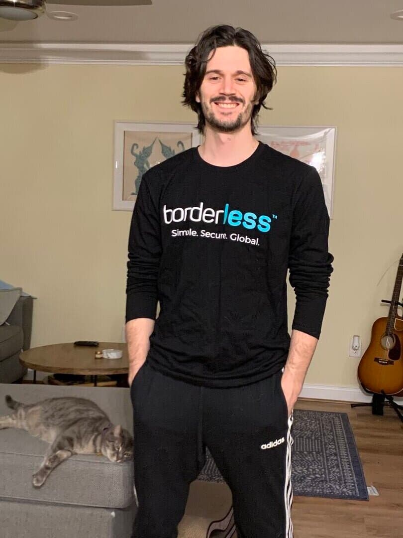 Playing guitar with cat nearby